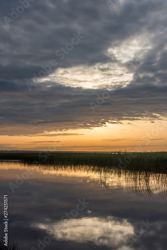 A Still Lake in Rural Latvia at Sunset