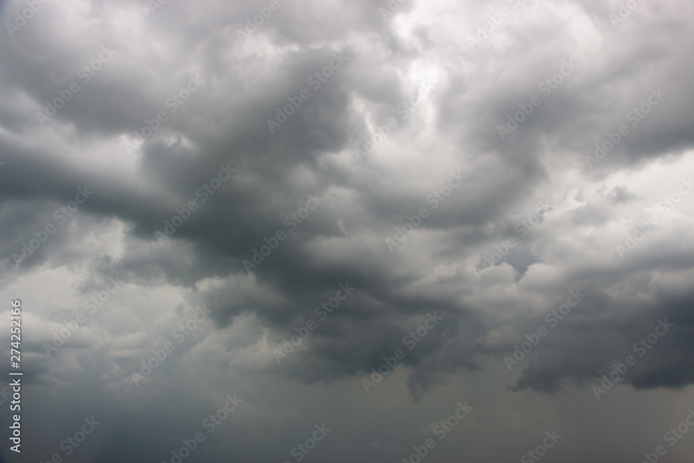 Light in the Dark and Dramatic Storm Clouds background