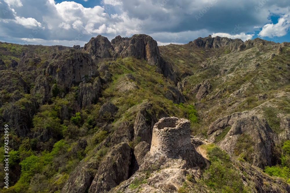 Ruins of an old tower on top of a cliff in Birtvisi canyon