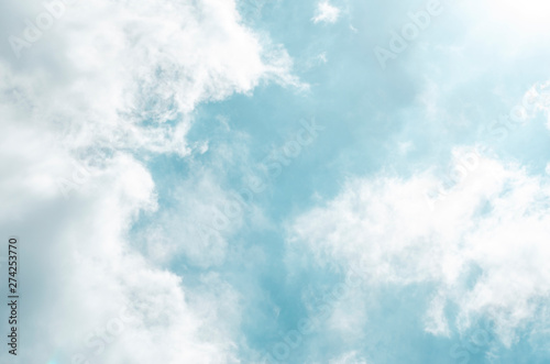 Blue sky and white clouds with blurred background patterns