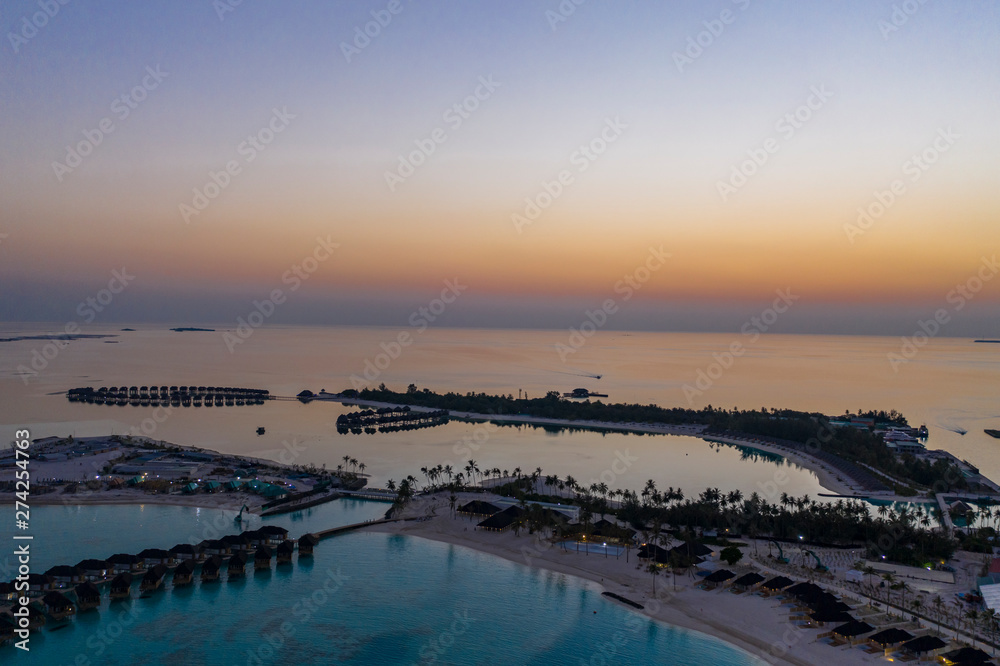 Fototapeta premium Aerial view, Maldives island with water bungalows, South Male Atoll Maldives