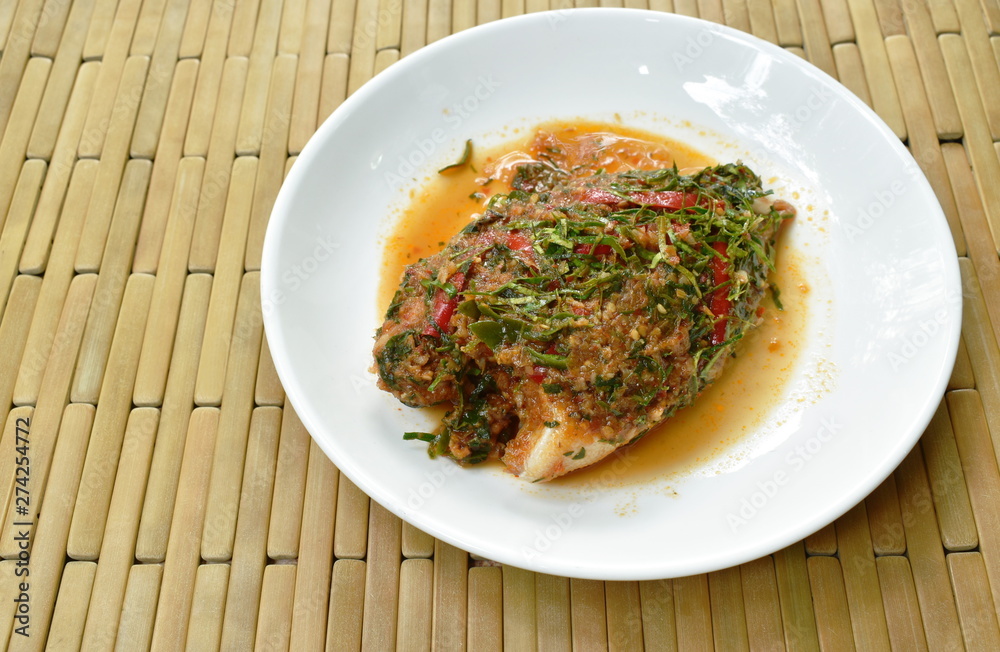 batter fried mango fish dressing spicy herb sauce on plate batter fried mango fish dressing spicy herb sauce on plate