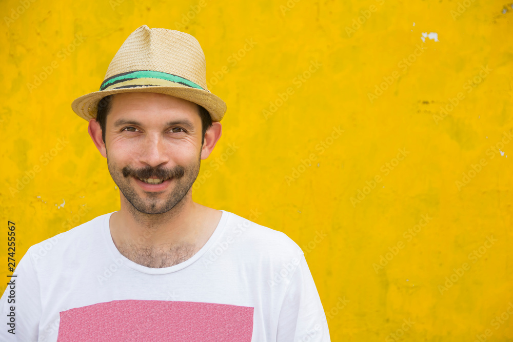 portrait of a young man on an old yellow background portrait of a young man on an old yellow background