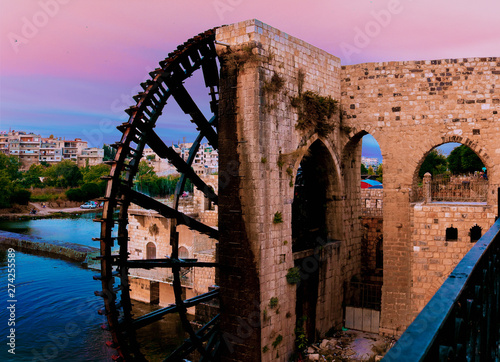 Fotografija An ancient water wheel from the Roman era in the city of Hama in SyriaAn ancient