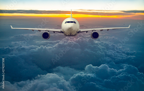 white, passenger airliner fly in sky