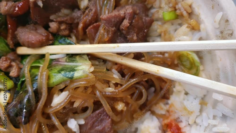 Delicious meaty bulgogi korean meal in a bowl, close up reveal shot