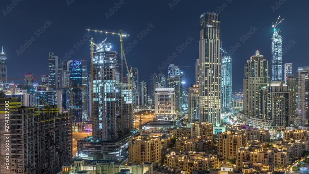 Beautiful skyline of Dubai downtown and Business bay with modern architecture night timelapse. Aerial view of Dubai illuminated skyscrapers from above with traffic on the road Beautiful skyline of Dubai downtown and Business bay with modern architecture night timelapse. Aerial view of Dubai illuminated skyscrapers from above with traffic on the road