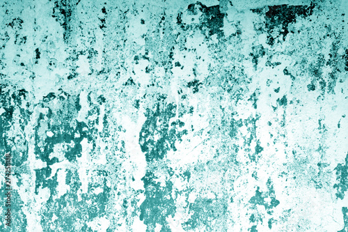 Сraked weathered cement wall texture in cyan tone. © pavelalexeev