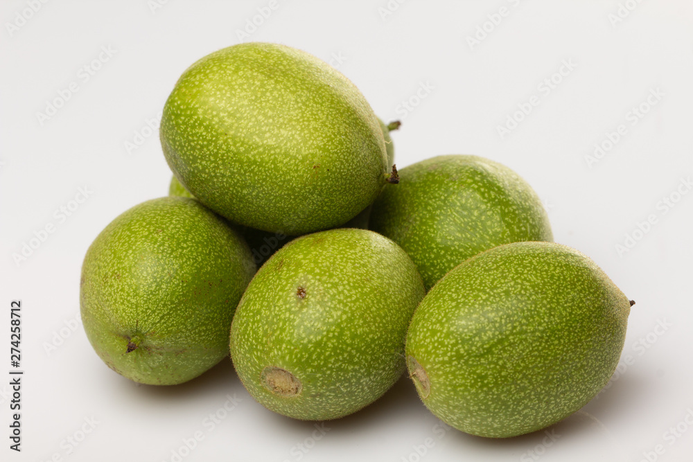 A group of salted walnuts on a white background. Medicinal oreg with high iodine content