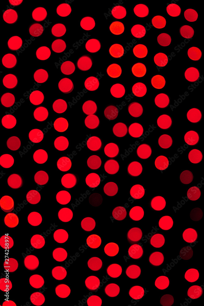 Unfocused abstract red bokeh on black background. defocused and blurred many round light Unfocused abstract red bokeh on black background. defocused and blurred many round light