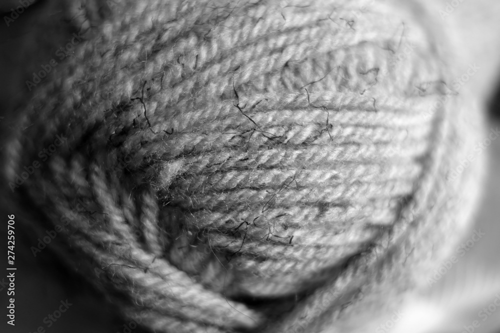 Yarn ball close-up with blur effect in black and white. Yarn ball close-up with blur effect in black and white.