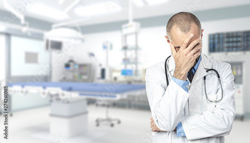 portrait of a stressed doctor inside a hospital