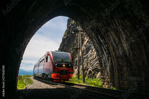 An electric train enters the tunnel