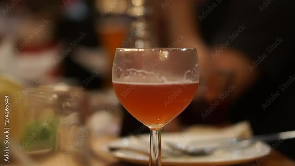 Red Ale beer glass at gathering in night bar restaurant Red Ale beer glass at gathering in night bar restaurant