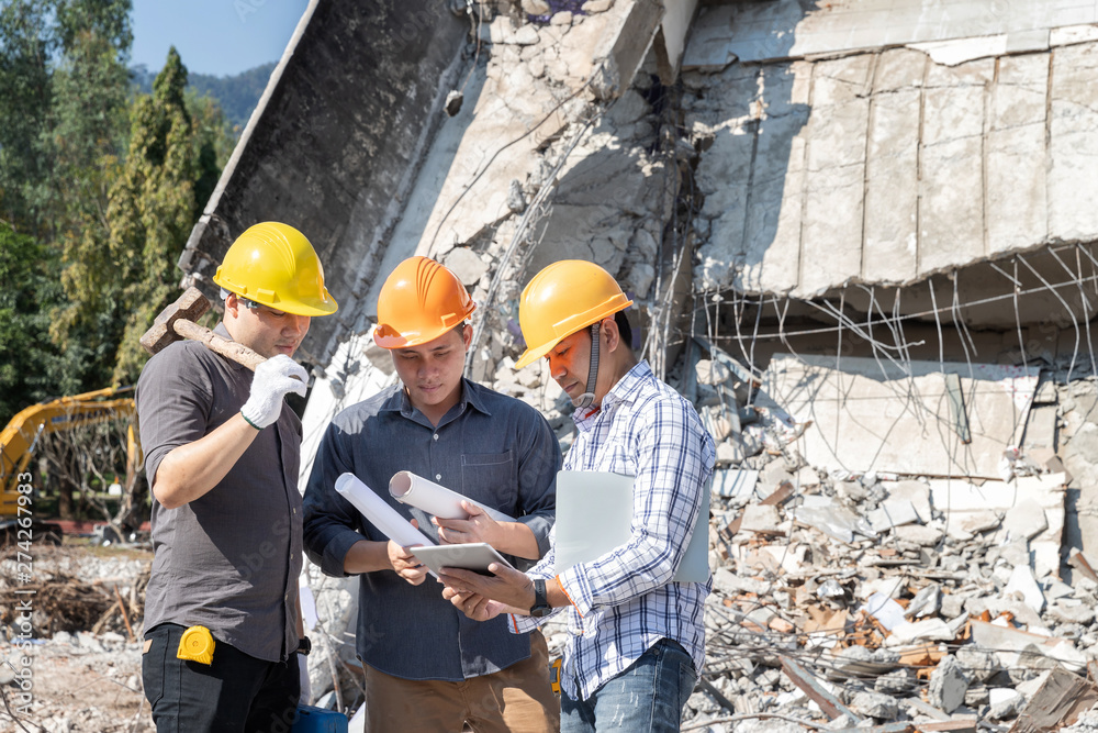 Demolition control supervisor and contractor discussing on demolish building. Demolition control supervisor and contractor discussing on demolish building.