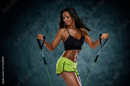 Sporty Woman Exercise With Resistance Bands © mrbigphoto