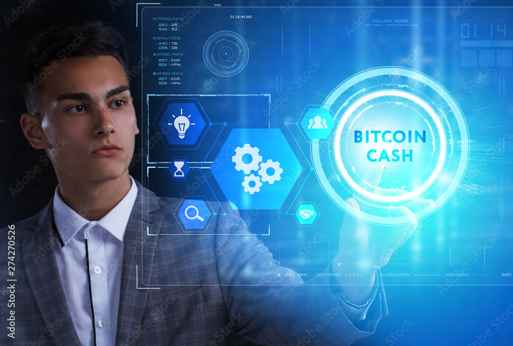The concept of business, technology, the Internet and the network. A young entrepreneur working on a virtual screen of the future and sees the inscription: Bitcoin cash The concept of business, technology, the Internet and the network. A young entrepreneur working on a virtual screen of the future and sees the inscription: Bitcoin cash