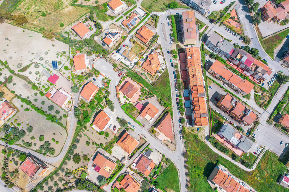 Aerial view town with houses and ceramic tiles, solar panels, streets. Aerial view town with houses and ceramic tiles, solar panels, streets.