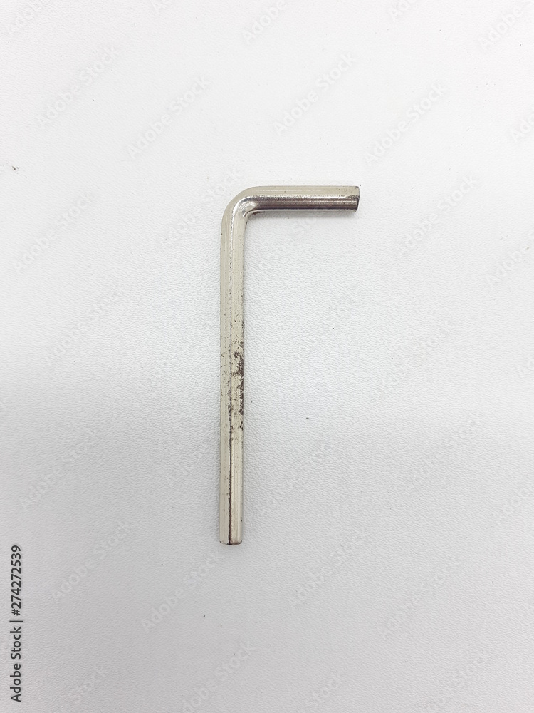 Stainless Steel L Key in White Isolated Background