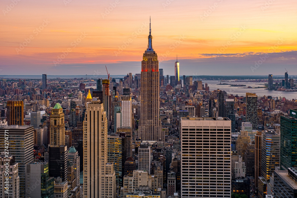 Cityscape of midtown skyscrapers and buildingds at sunset view from rooftop Rockefeller Center