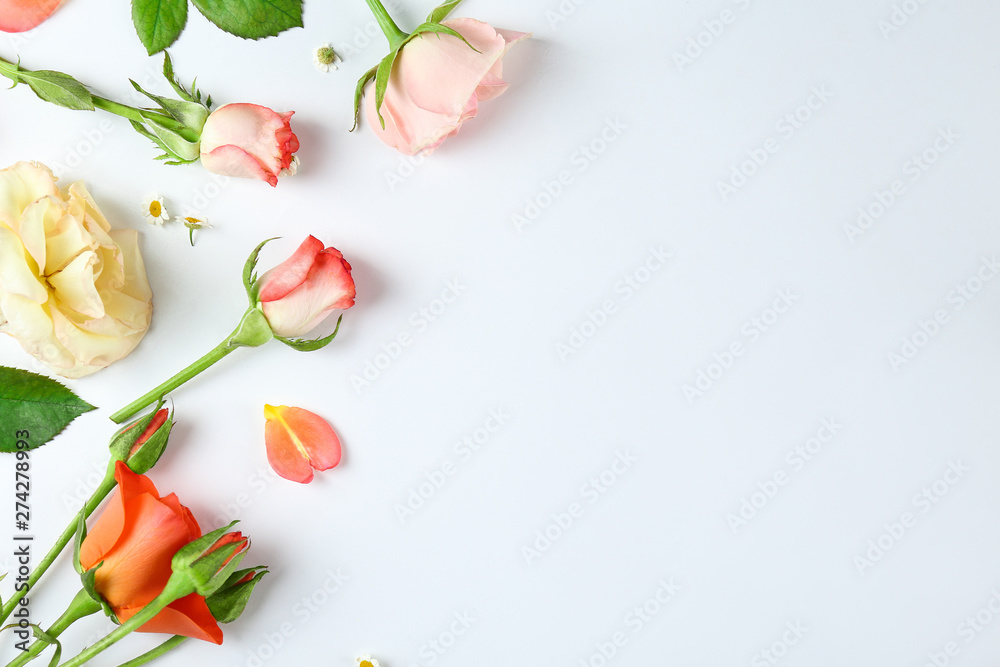 Feminine frame background made of various flowers with a lot of copy space for text. Close up, top view, flat lay. Feminine frame background made of various flowers with a lot of copy space for text. Close up, top view, flat lay.
