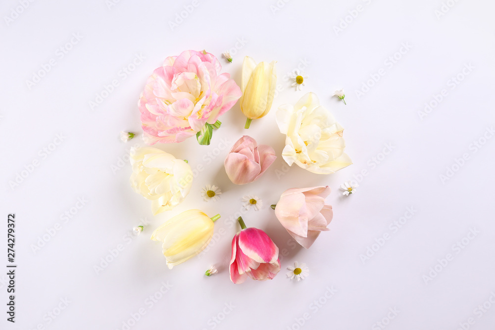 Feminine frame background made of various flowers with a lot of copy space for text. Close up, top view, flat lay. Feminine frame background made of various flowers with a lot of copy space for text. Close up, top view, flat lay.