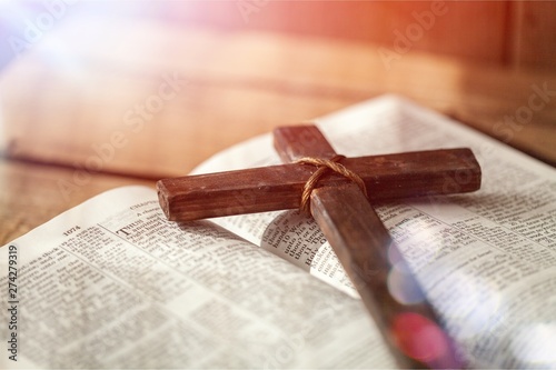 Holy Bible book and cross, close-up view