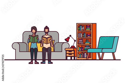 couple with book in hands in living room