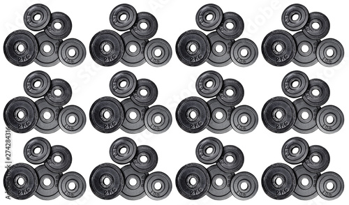 Pattern made from a stack metal weights 1kg and 2kg, isolated on white background with clipping path. Top view, flat lay. Can be used as a gym background.