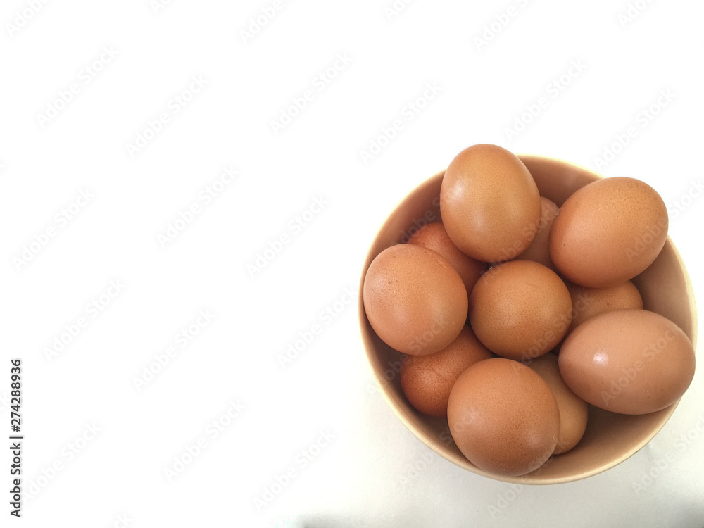 Eggs: brown eggs in separate cups on a white background in close-up shot from top to bottom Thailand Eggs: brown eggs in separate cups on a white background in close-up shot from top to bottom Thailand