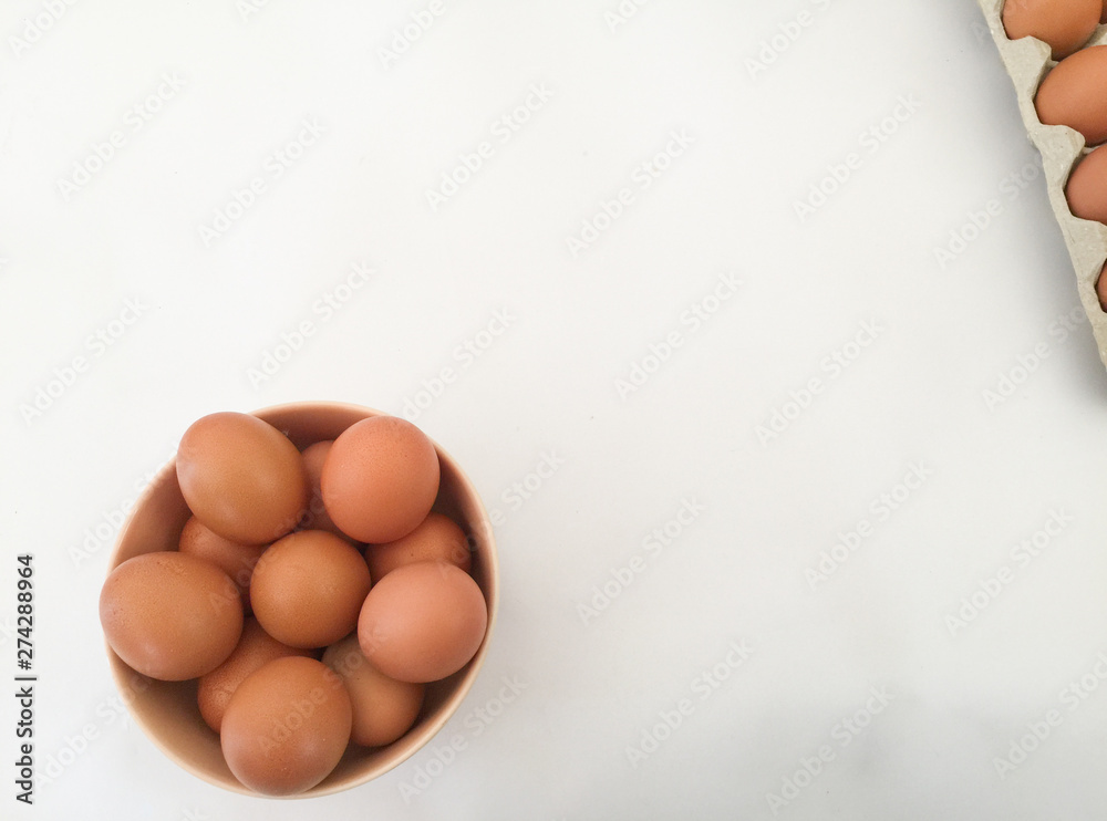 Eggs: brown eggs in separate cups on a white background in close-up shot from top to bottom Thailand Eggs: brown eggs in separate cups on a white background in close-up shot from top to bottom Thailand