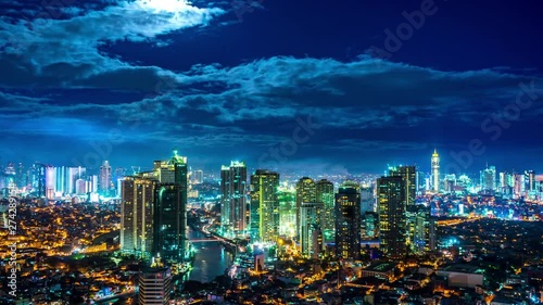Time-lapse view on the illuminated skyline of Makati during sunset. 