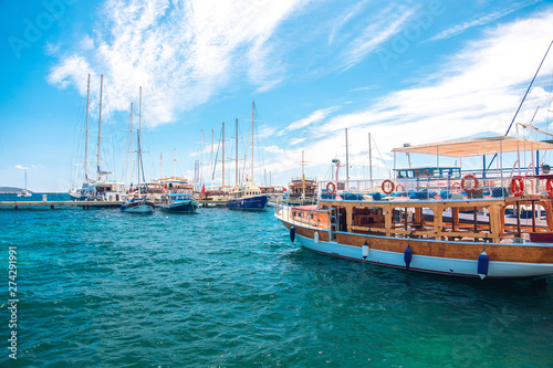 Fototapeta Naklejka Na Ścianę i Meble -  View of the Bodrum Marina, sailing boats and yachts in Bodrum town, city of Turkey. Shore and coast of Aegean Sea with yachts 