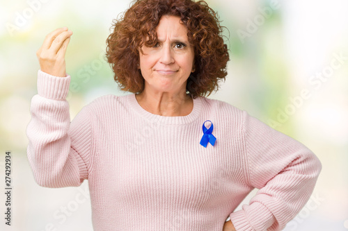 Middle ager senior woman wearing changeable blue color ribbon awareness over isolated background Doing Italian gesture with hand and fingers confident expression