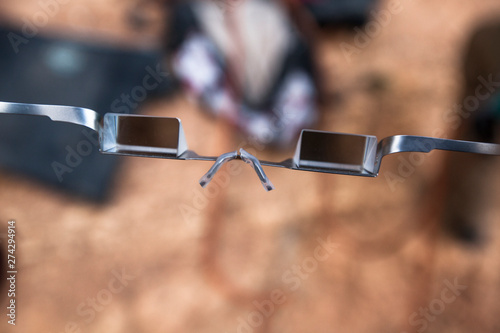 A closeup of a pair of belay glasses. The mirrors allow a belayer to see a climber above them without having to fatigue their neck while belaying on steep climbs. photo