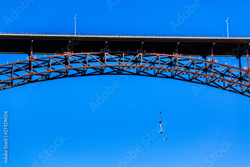 BASE jumpers making the leap off the 486-foot Perrine Bridge in Twin Falls, Idaho over the scenic Snake River. The bridge is the only manmade structure in the U.S. that is legal to jump from. photo