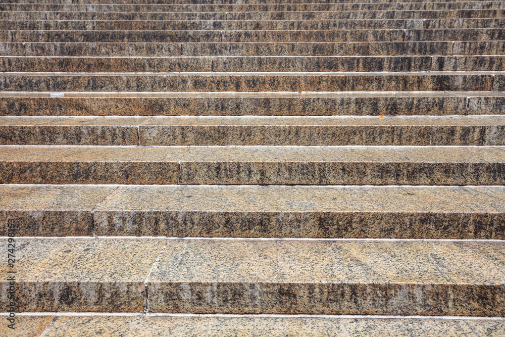 Granite material stairs background, texture. Gray yellow color