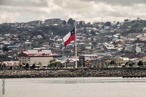 Chile flag on a hillside bay 