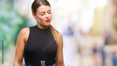 Young beautiful elegant business woman over isolated background looking away to side with smile on face  natural expression. Laughing confident.
