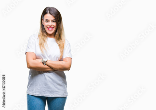 Young beautiful woman casual white t-shirt over isolated background happy face smiling with crossed arms looking at the camera. Positive person.