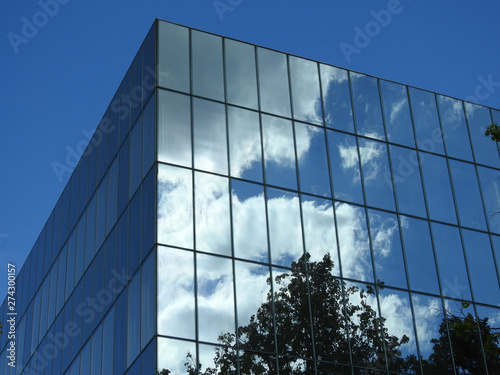 Clouds in the reflecting surface of o modern building