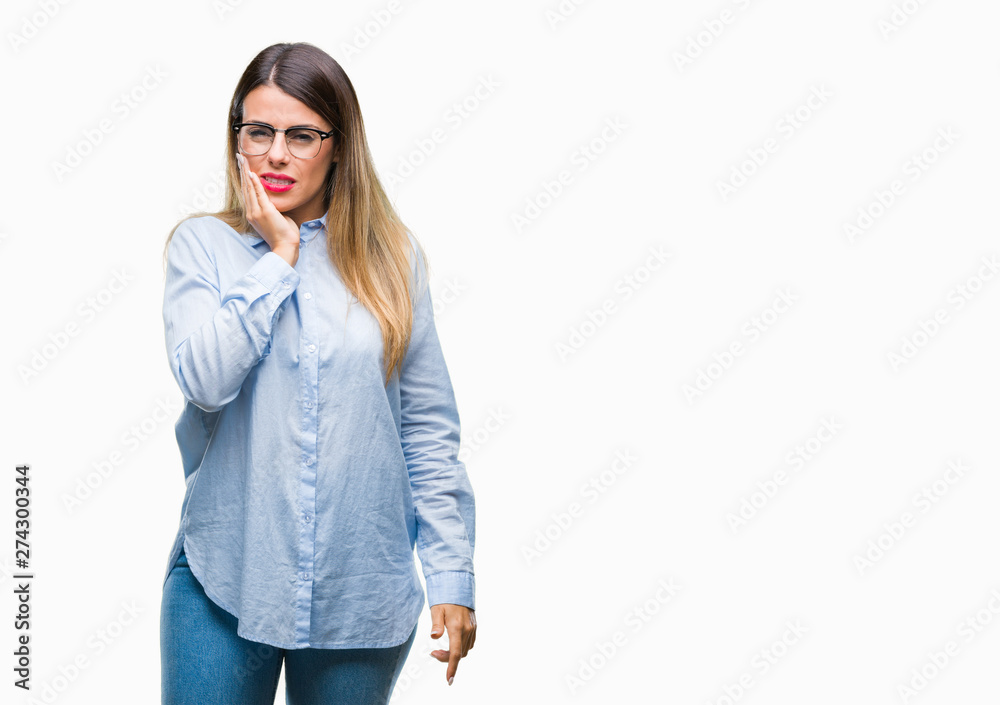 Fototapeta premium Young beautiful business woman wearing glasses over isolated background touching mouth with hand with painful expression because of toothache or dental illness on teeth. Dentist concept.