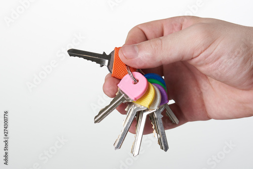 Hand holding colorful keys