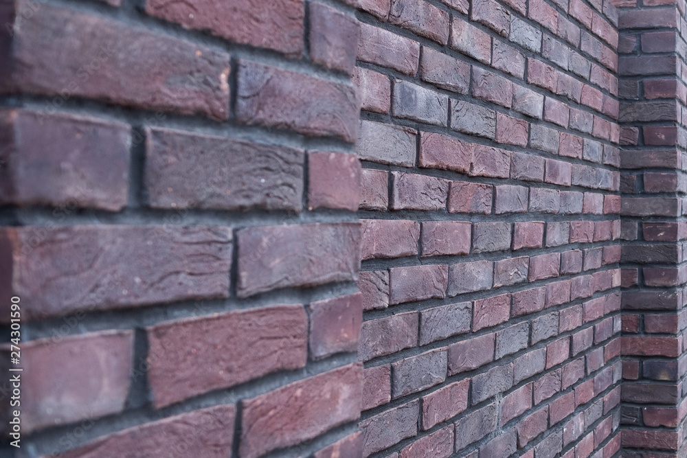 Brick wall. Background from a dark brick wall. Texture of the bricks. Brick wall. Background from a dark brick wall. Texture of the bricks.
