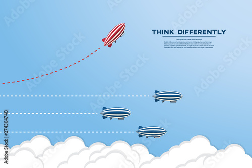 Think differently concept. Be different. Red zeppelin changing direction. New idea, change, trend, courage, creative solution, innovation and unique way concept.