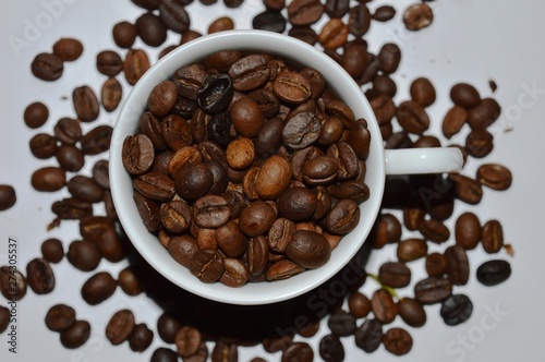 black coffee beans in a cup