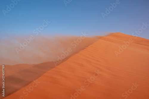 Landscape view of sand dunes during the windy weather  Sahara  Morocco.