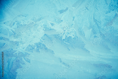 An icy, frost background image. In this image, you can see the unique patterns created when frost forms on glass.