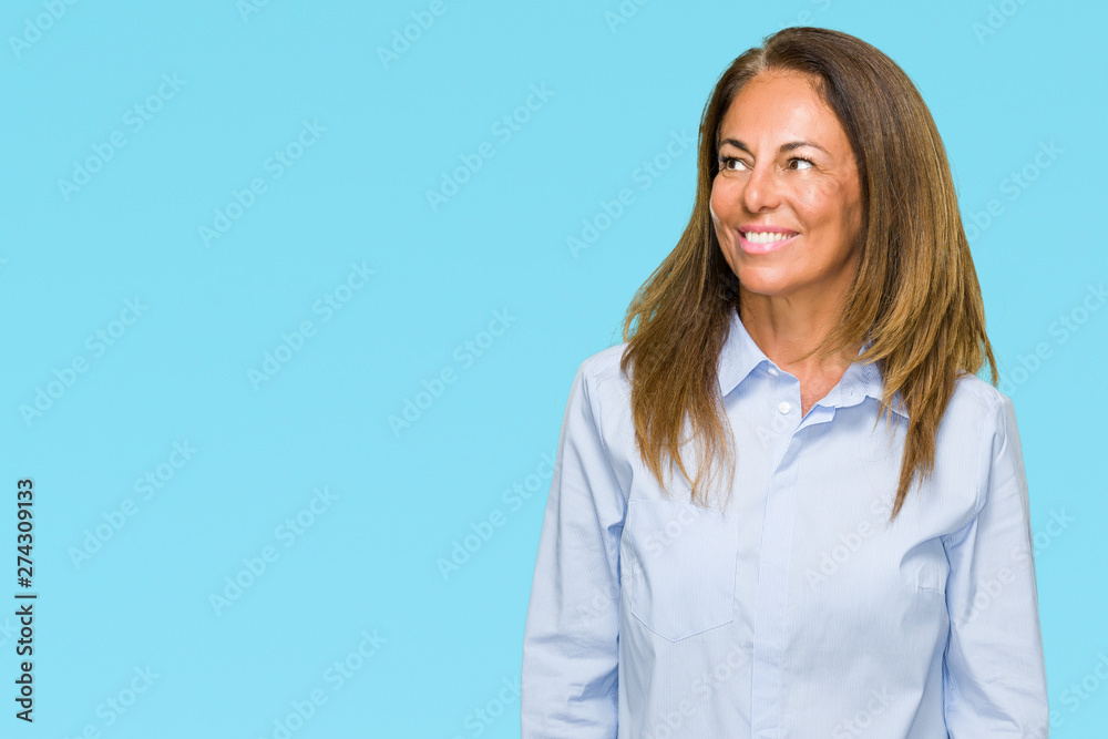 Beautiful middle age business adult woman over isolated background looking away to side with smile on face, natural expression. Laughing confident. Beautiful middle age business adult woman over isolated background looking away to side with smile on face, natural expression. Laughing confident.