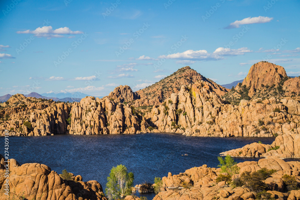 The rugged beauty of Watson Lake in Prescott Arizona.  This reservoir is surrounded be weathered cliffs of the Granite Dells and blear blue skies.